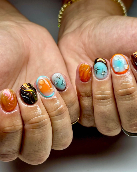 taylor swift tloas nails orange and blue nail art