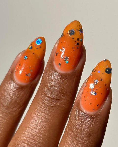 taylor swift tloas nails orange jelly nails with glitter