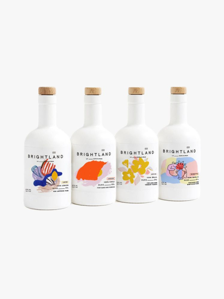 Brightland The Artist Capsule 4Piece Infused Olive Oil Set four white bottles on light gray background