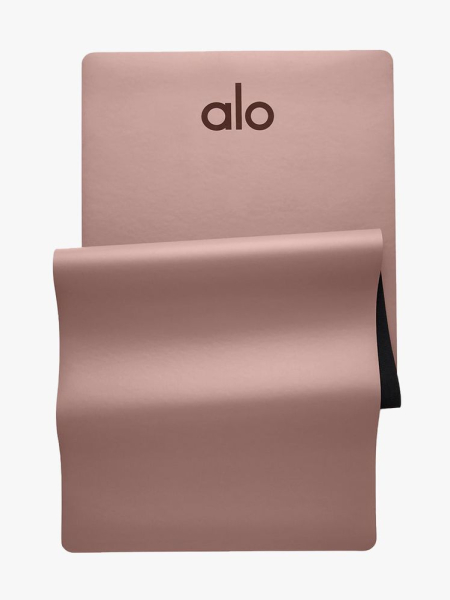 Alo Warrior Mat muted rose half folded yoga mat on light gray background