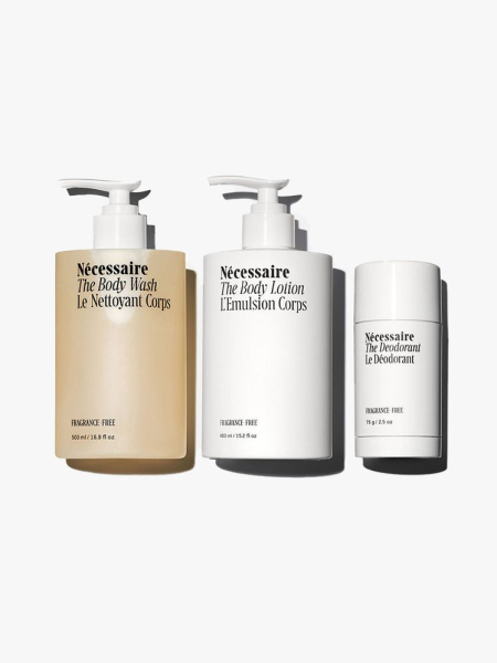 Necessaire The Body Essentials two pump bottles and deodorant on light gray background