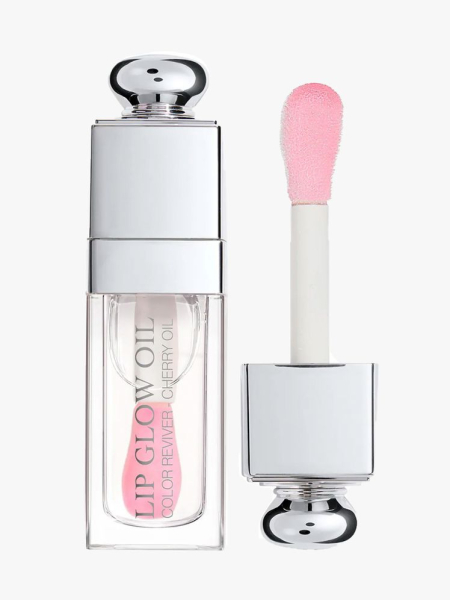 Dior Lip Glow Oil vial of clear lip gloss with silver bauble cap on light gray background